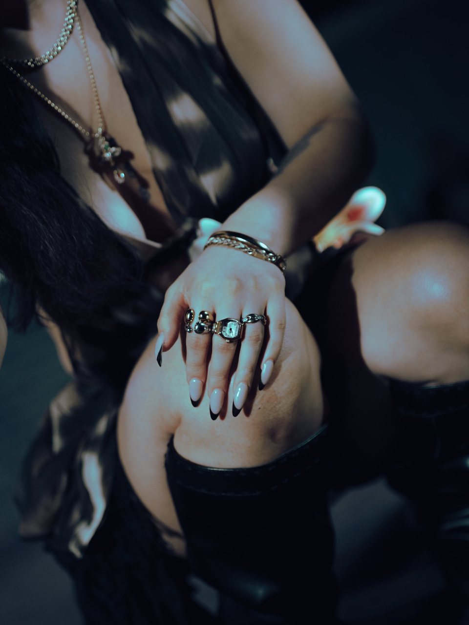 Close detail of rings, bracelets and a watch.