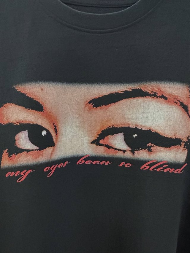 The “my eyes been so blind” t-shirt laid flat.